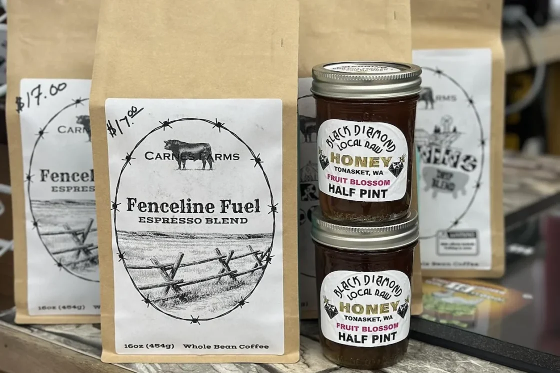 Carnesi Farms Fenceline Fuel espresso blend whole bean coffee (16oz) displayed with Black Diamond local raw fruit blossom honey half pint jars from Tonasket, WA for foodservice wholesale distribution.